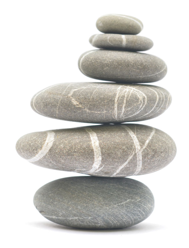 balancing stones isolated on white background
